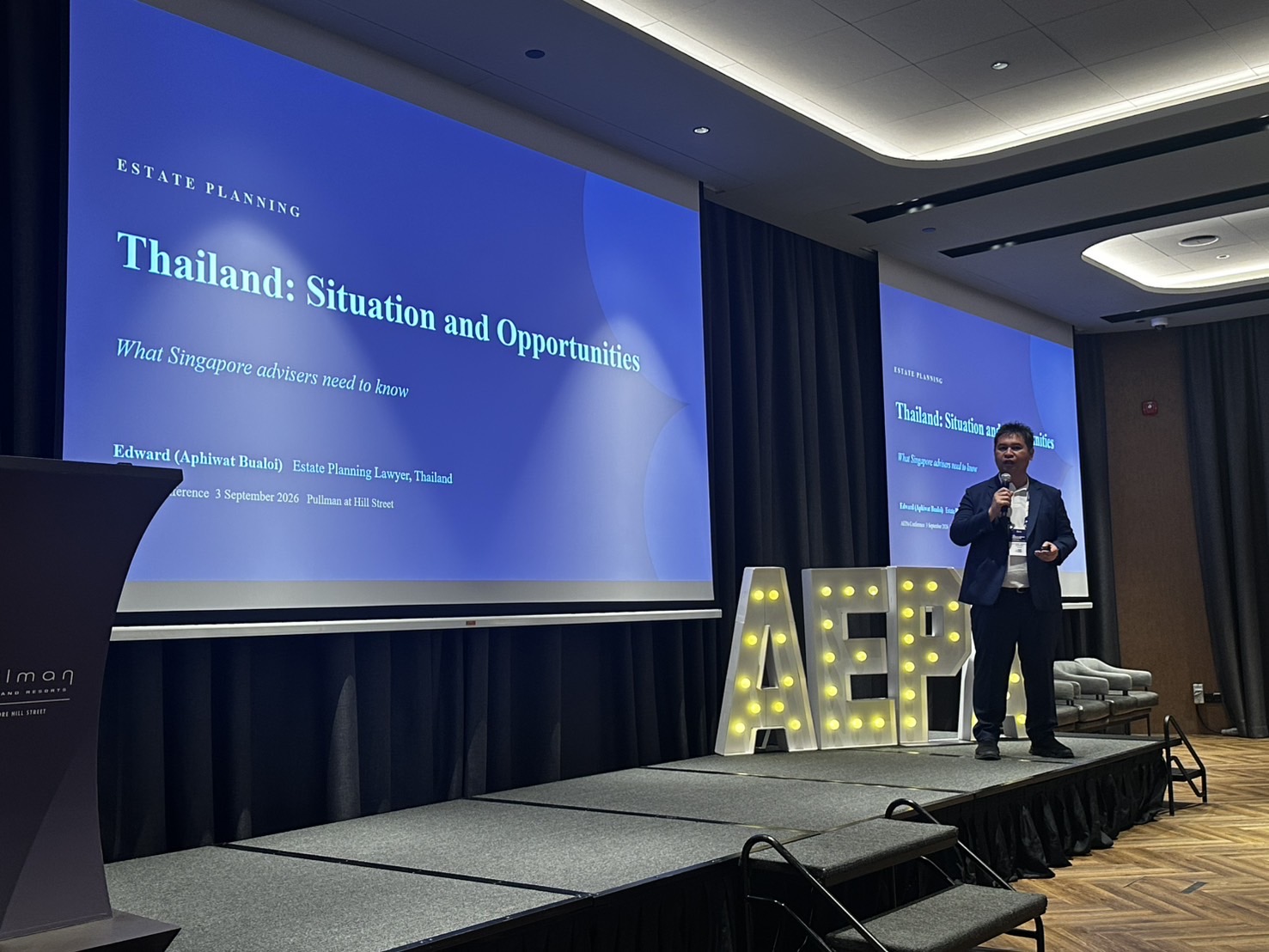 Aphiwat Bualoi, Esq. speaking on stage at the AEPA Conference 2026 in Singapore